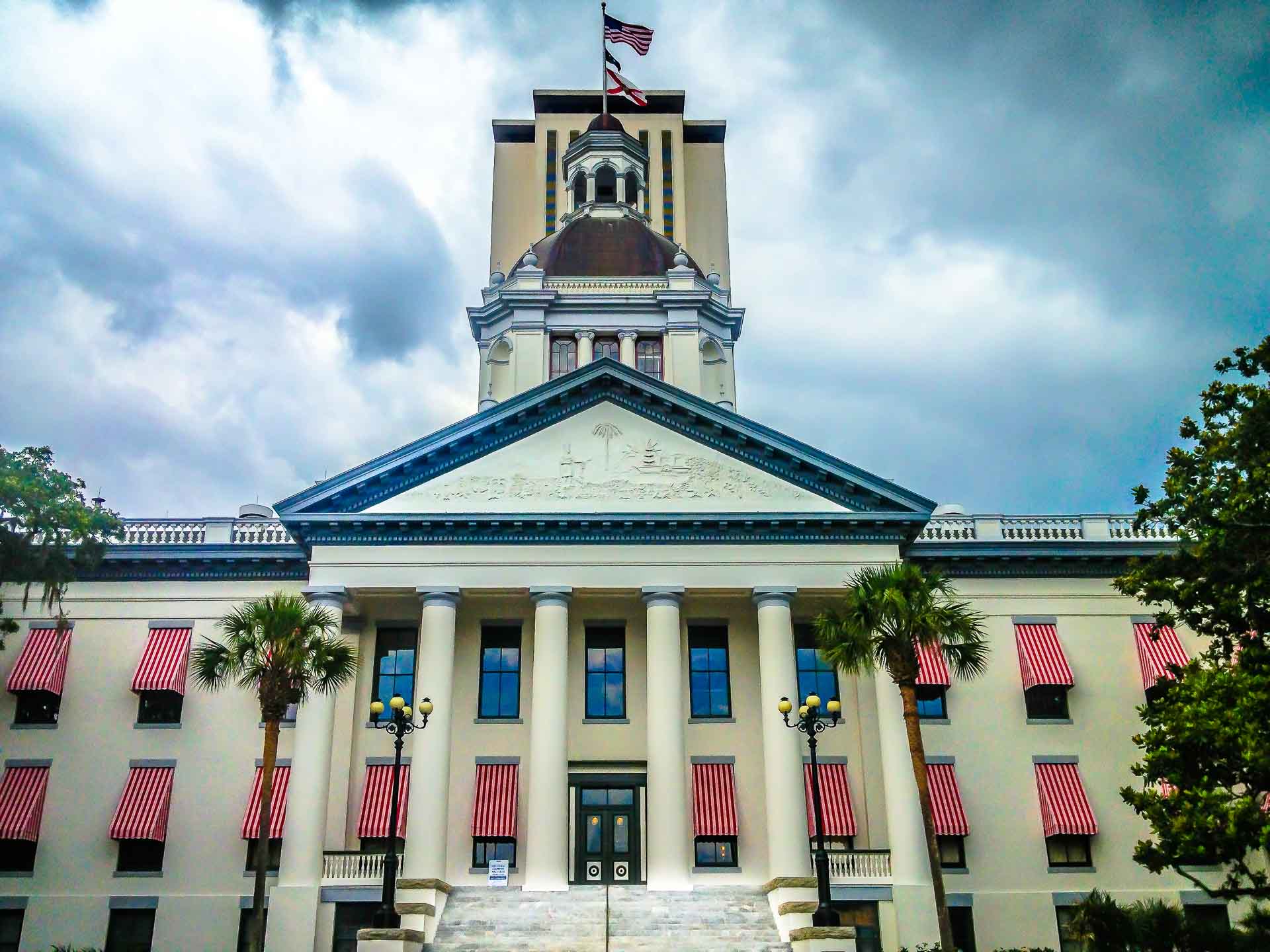 Florida State Capitol Building, Tallahassee — Greek Revival facade under stormy skies